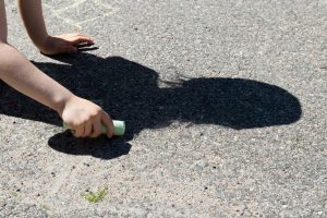 child outline shadow with chalk