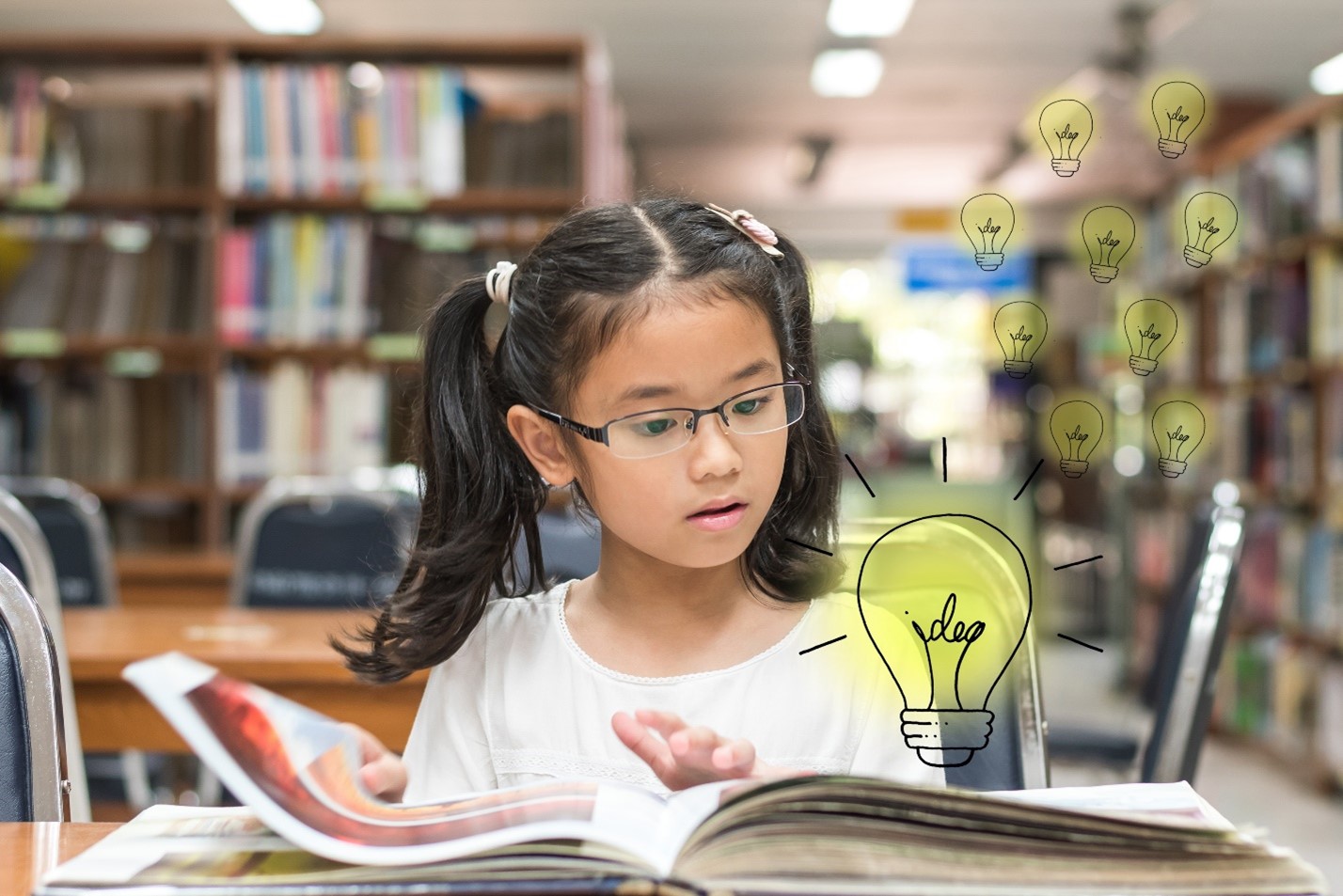 Girl reading with idea