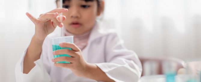 Girl performing science experiment